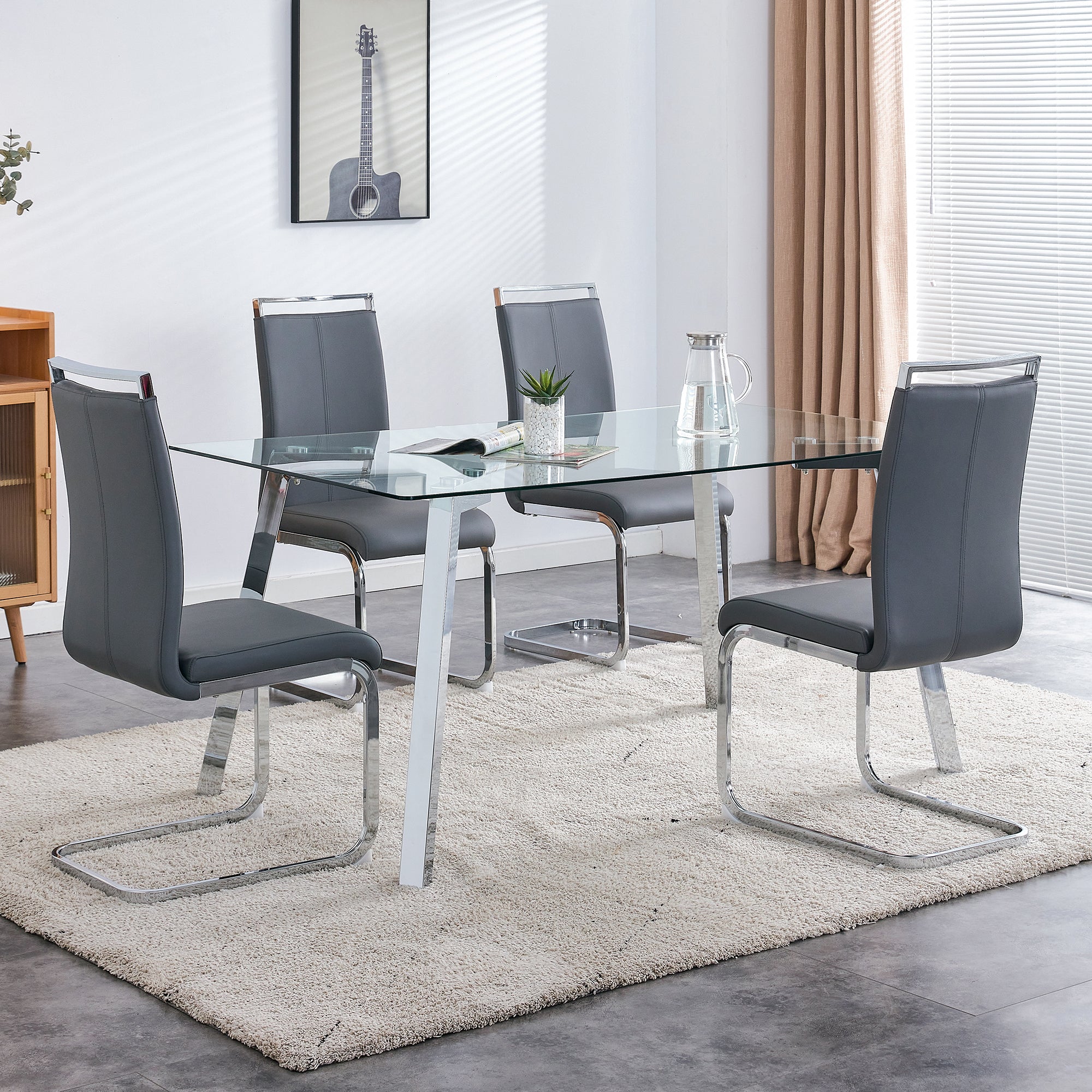 A modern minimalist rectangular glass dining table with tempered glass tabletop and silver metal legs, suitable for kitchens, restaurants, and living rooms,63"*35.4"*30"