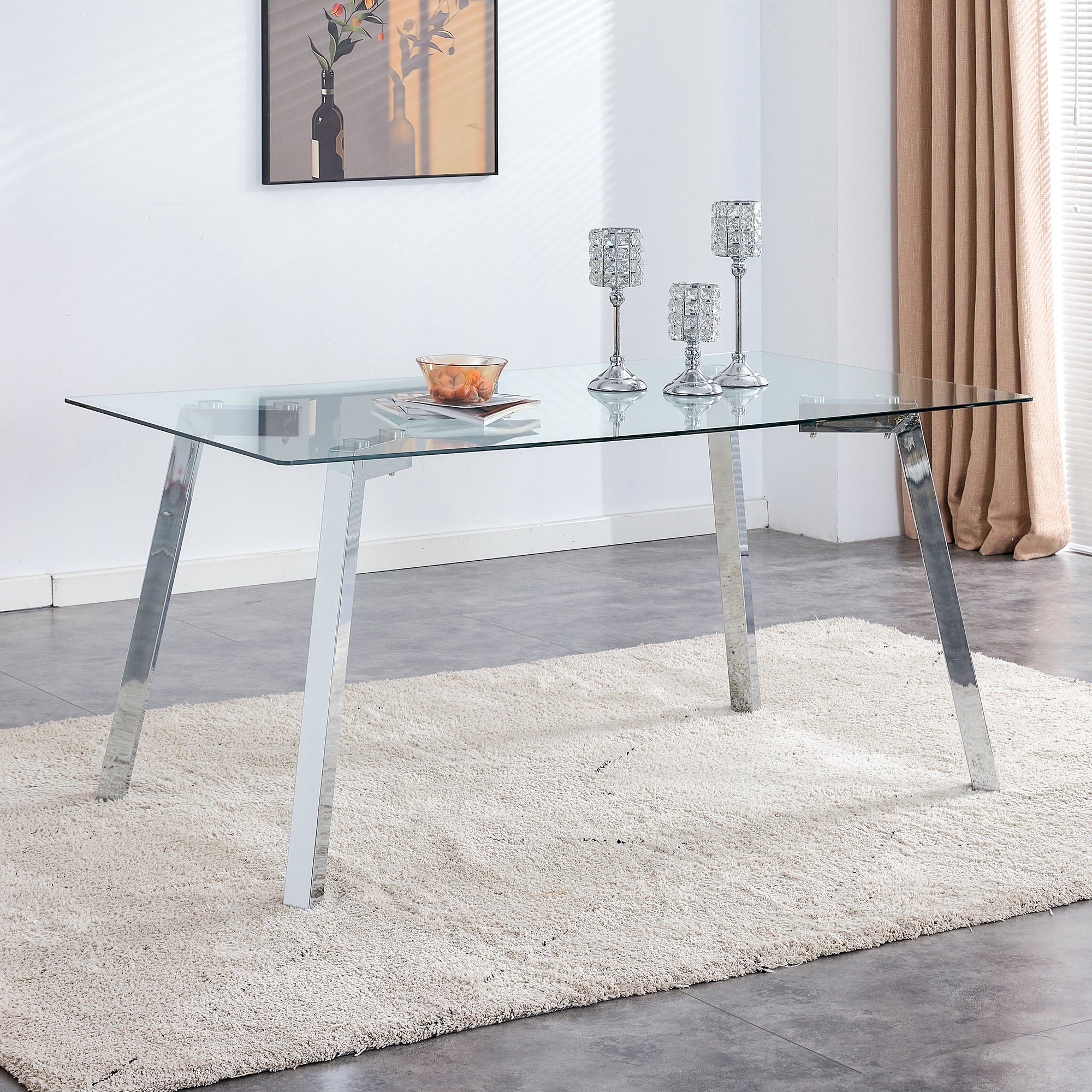 A modern minimalist rectangular glass dining table with tempered glass tabletop and silver metal legs, suitable for kitchens, restaurants, and living rooms,63"*35.4"*30"