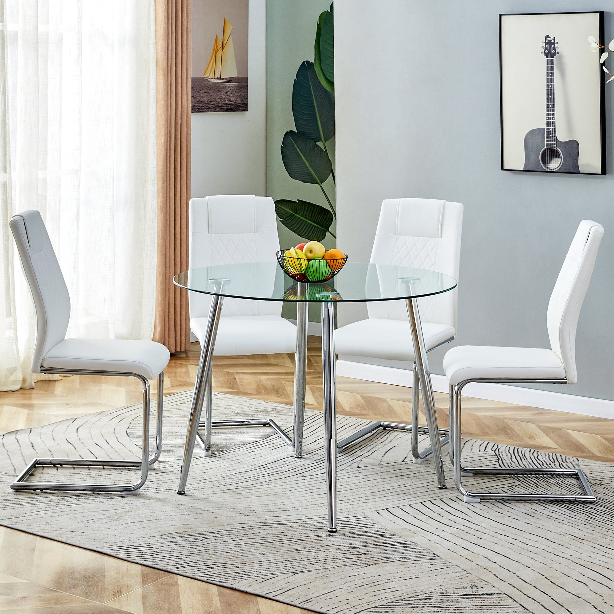 Table and chair set. (1 table+4 chairs set) A circular dining table with a 40 inch diameter glass tabletop and electroplated  metal legs. 4 white PU chairs DT-1164 001