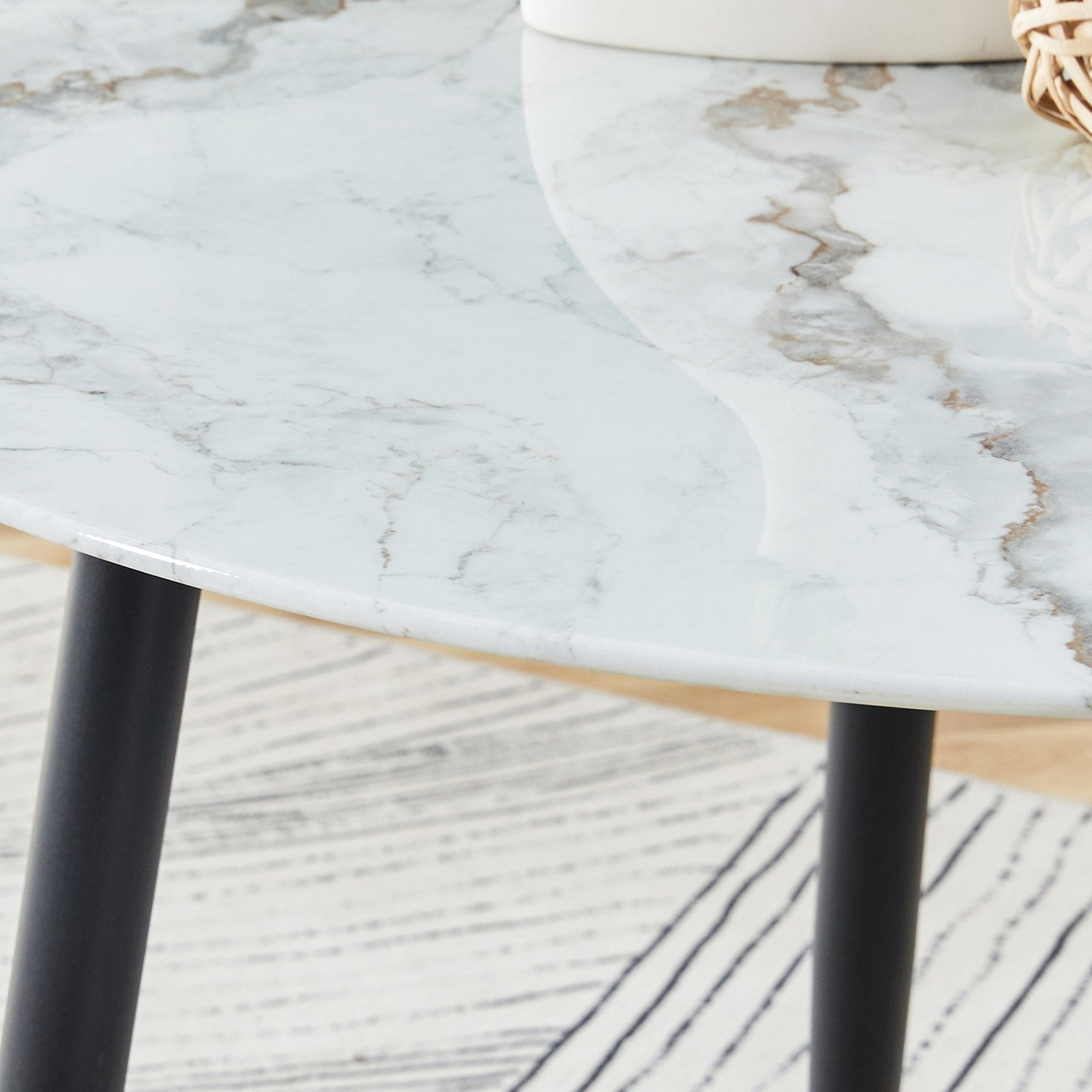 A modern minimalist circular dining table with a diameter of 40 inches, a 0.3 inch thick white imitation marble pattern tabletop and black metal legs  40 '* 40' * 30 'DT-1164