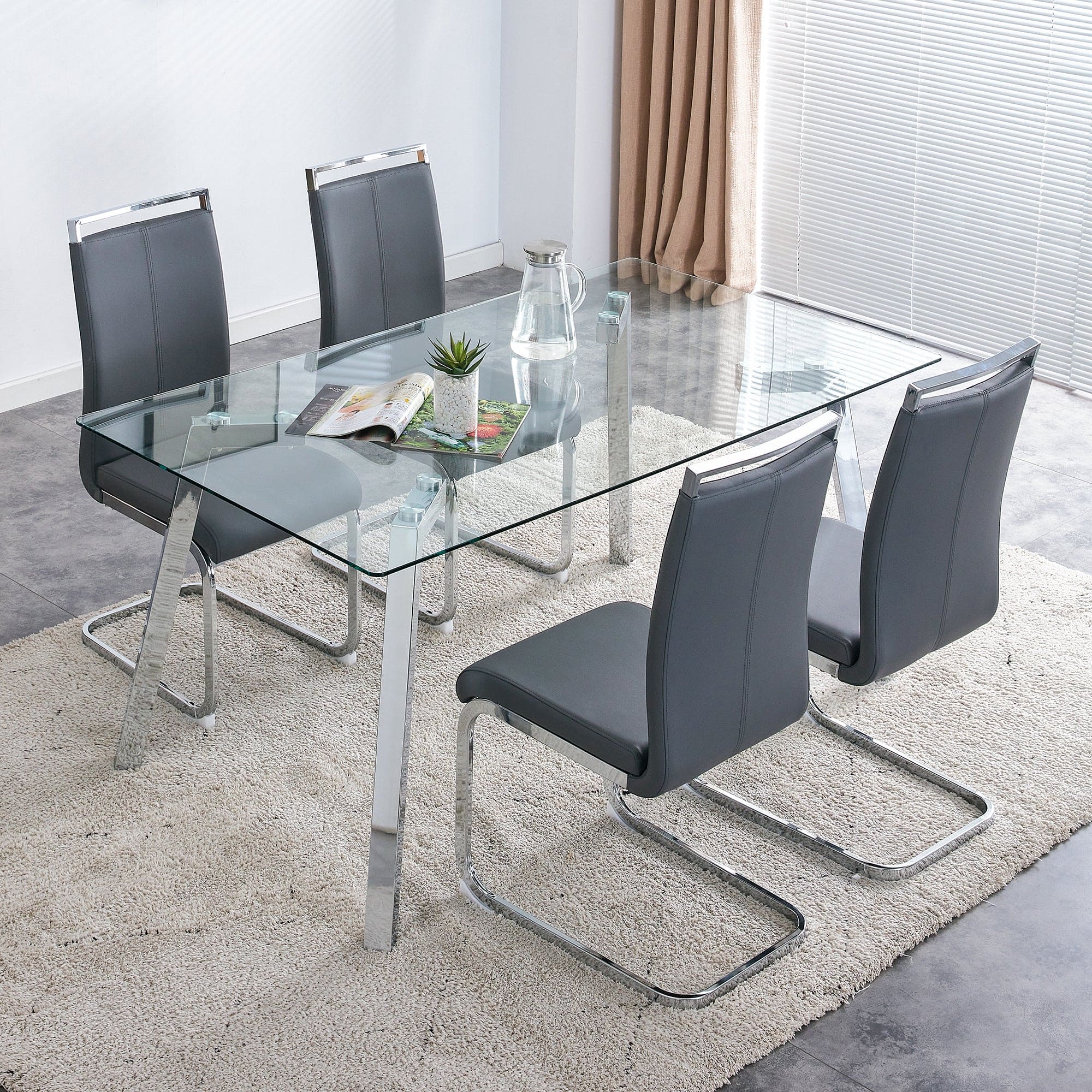 A modern minimalist rectangular glass dining table with tempered glass tabletop and silver metal legs, suitable for kitchens, restaurants, and living rooms,63"*35.4"*30"