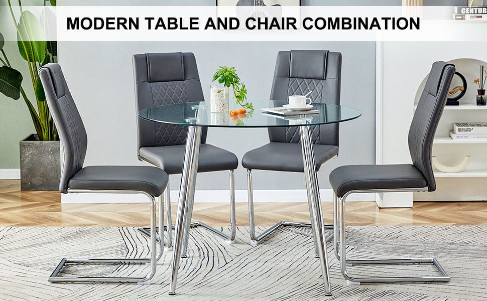 Table and chair set. (1 table+4 gray chairs) Round dining table with a 40 inch diameter glass tabletop and silver plated metal legs. 4 gray PU chairs DT-1164 001