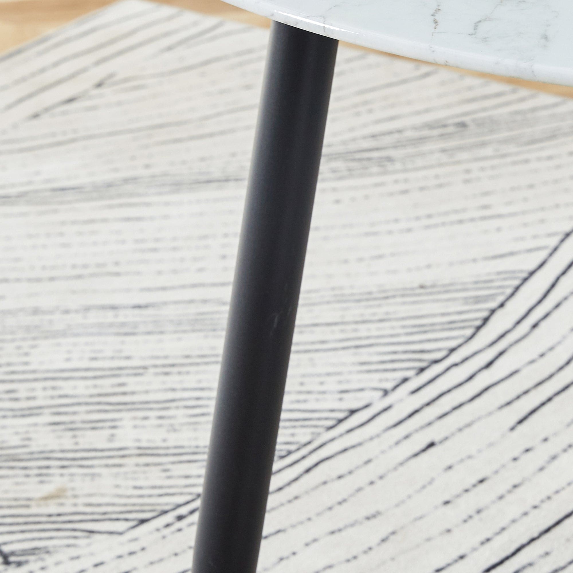 A modern minimalist circular dining table with a diameter of 40 inches, a 0.3 inch thick white imitation marble pattern tabletop and black metal legs  40 '* 40' * 30 'DT-1164