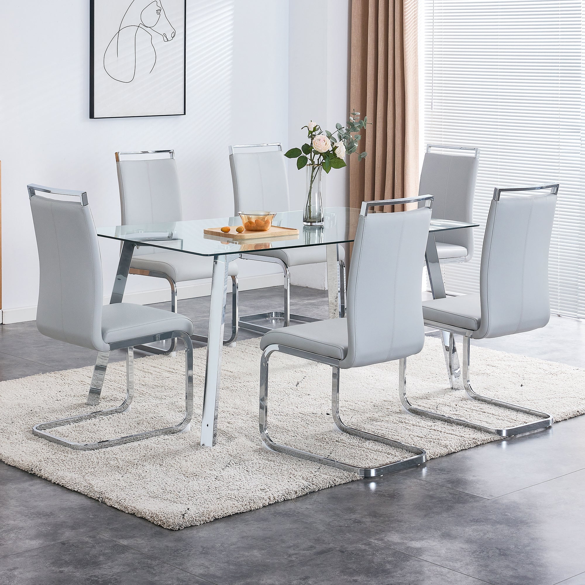 A modern minimalist rectangular glass dining table with tempered glass tabletop and silver metal legs, suitable for kitchens, restaurants, and living rooms,63"*35.4"*30"